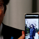 Takuya Yokota shows a picture of his sister Megumi Yokota, a Japanese national abducted by North Korean agents decades ago.